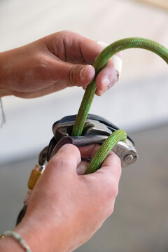 Rope threaded through belay device