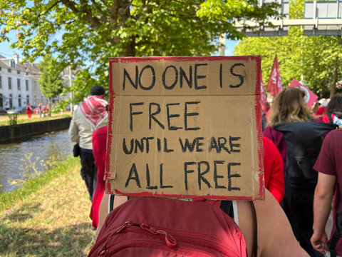 protester with sign on his back