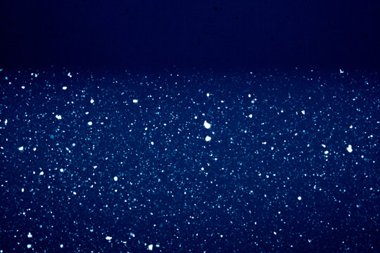 Silent Snowfall in Deep Blue