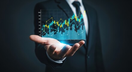 Businessman in suit presenting a glowing upward trending stock market graph on his open palm.