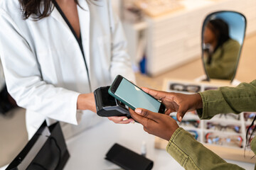Contactless Payment at an Optician's Store Counter