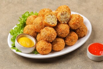 Bitterballen is the name of a type of food in the Netherlands. Bitterballen taste similar to croquettes, but are small round shapes about 3 to 4 cm
