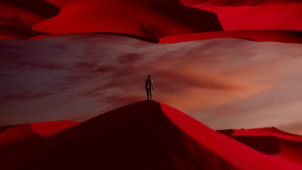 Silhouette of a man against vivid surreal landscape at sunset