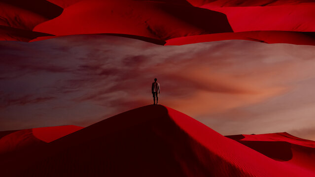 Silhouette of a man against vivid surreal landscape at sunset