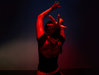 Dynamic dancer showcases expressive movement in dramatic lightin