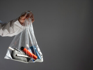 Electronic cigarettes and disposable vapes in a bag. 