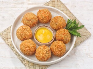 Bitterballen is the name of a type of food in the Netherlands. Bitterballen taste similar to croquettes, but are small round shapes about 3 to 4 cm