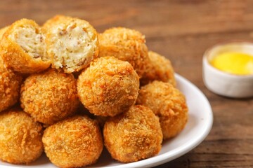 Bitterballen is the name of a type of food in the Netherlands. Bitterballen taste similar to croquettes, but are small round shapes about 3 to 4 cm
