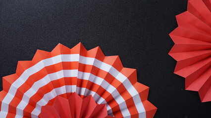 Independence Day Indonesia banner mockup with Indonesia flag color paper fans isolated on black background