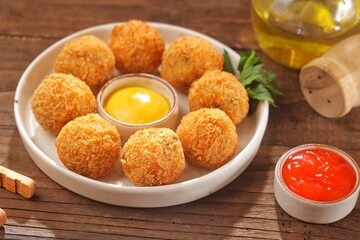 Bitterballen is the name of a type of food in the Netherlands. Bitterballen taste similar to croquettes, but are small round shapes about 3 to 4 cm