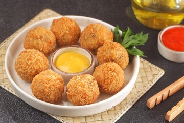 Bitterballen is the name of a type of food in the Netherlands. Bitterballen taste similar to croquettes, but are small round shapes about 3 to 4 cm