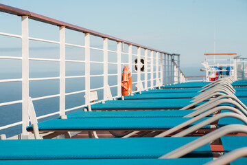 Blue Lounge Chairs on a Cruise Deck 