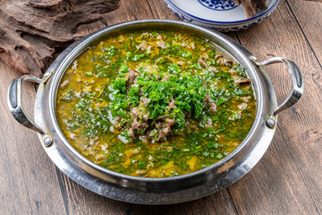 Boiled beef in sour soup with onion