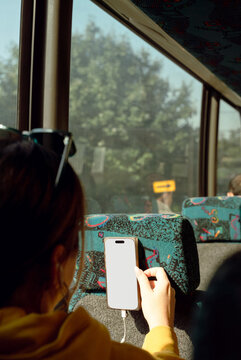 Passenger Using Blank Smartphone on a Bus Ride
