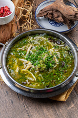 Shredded pork belly in sour soup with onion
