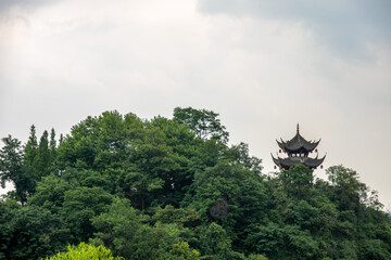 Historic pagoda nestled in lush greenery near DuJiangYan, Sichua