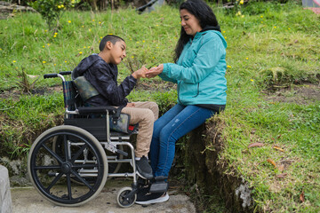 Caring interaction between woman and child in wheelchair