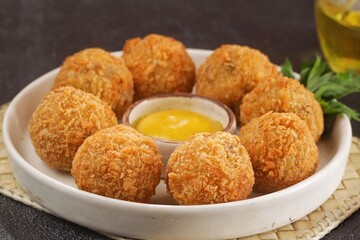 Bitterballen is the name of a type of food in the Netherlands. Bitterballen taste similar to croquettes, but are small round shapes about 3 to 4 cm