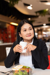Woman in restaurant holding coffee cup