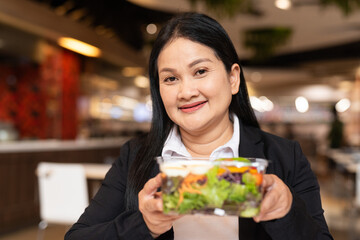 woman eating salad