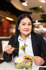 Woman eating salad