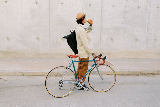 Man drinks coffee with bicycle