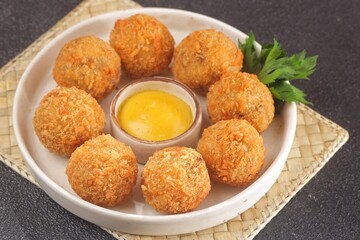 Bitterballen is the name of a type of food in the Netherlands. Bitterballen taste similar to croquettes, but are small round shapes about 3 to 4 cm