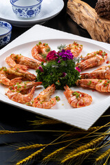 Fried king prawns on a black background