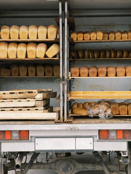 Delivery Truck Loaded with Freshly Baked Bread Loaves on Shelves