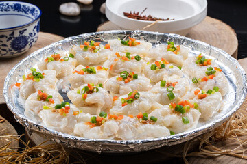 Sizzling prawns on a camphorwood chopping board