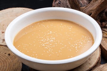 White porcelain bowl of bean flour paste