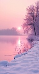 Pink winter sunrise over a frozen river.  A serene landscape bathed in soft, pastel pink light.  Bare, snow-covered trees line the riverbank. 