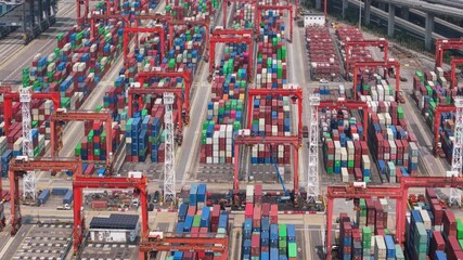 Massive Container Cranes Transporting Cargo Containers at the Hong Kong Maritime Port, Highlighting the Global Logistics Network and the Role of International Trade in Asia's Economic Growth. Cargo
