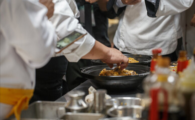 People and food in a busy Chinese kitchen