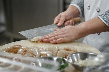 People and food in a busy Chinese kitchen