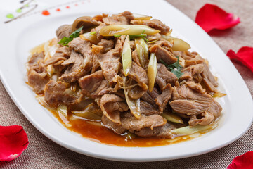 White long porcelain plate with king oyster mushroom cubes