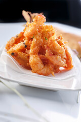 French style sizzling salt and pepper shrimp on a white porcelain plate