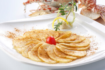 Grilled potato chips on a white porcelain plate