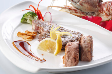 French foie gras and sizzling sirloin steak served in exquisite tableware