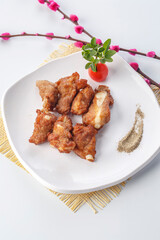 Grilled lamb ribs on a white porcelain plate