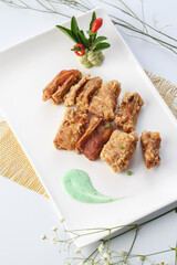 Fried pork belly in exquisite tableware