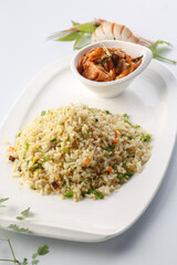 French-style iron plate fried rice with assorted vegetables served in exquisite tableware