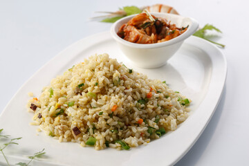 French-style iron plate fried rice with assorted vegetables served in exquisite tableware