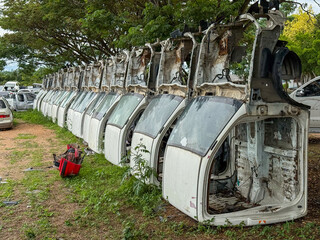 Stripped Car Cabins in a Row for Spare Part Recycling as Concept of Traffic Safety and Car...
