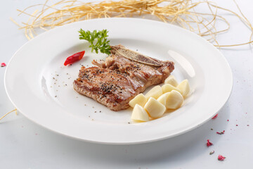 French-style grilled garlic and pepper beef short ribs in exquisite tableware