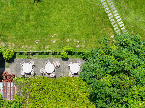 Aerial View of Outdoor Patio with Tables and Chairs in a Garden