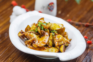 The leaf-shaped porcelain plate with fried bean curd is green