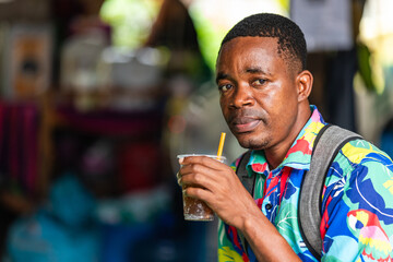 Tourist resting in a small Thai shop after exploring the street market