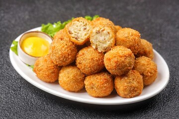 Bitterballen is the name of a type of food in the Netherlands. Bitterballen taste similar to croquettes, but are small round shapes about 3 to 4 cm