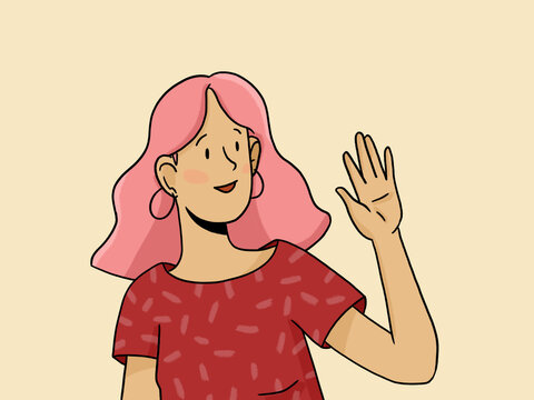 Smiling young woman with pink hair waving hand in greeting